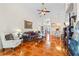 The living room features tile flooring, neutral walls, and views into the dining area at 322 High Vista, Davenport, FL 33837