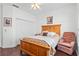 Inviting main bedroom with a cozy chair, closet space, and a soft color palette at 322 High Vista, Davenport, FL 33837