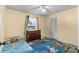 Cozy bedroom with natural light, closet, and colorful rug at 3325 Dove Ln, Mulberry, FL 33860