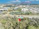 Aerial view of property near UCF featuring a serene pond and lush green surroundings at 3508 Rouse Rd, Orlando, FL 32817