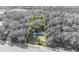 Aerial view of property outlined in yellow, surrounded by trees and road access at 3508 Rouse Rd, Orlando, FL 32817