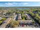 Community aerial view showcasing well-maintained buildings surrounded by lush greenery and lake views at 4214 Lake Underhill Rd # A, Orlando, FL 32803