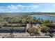 Aerial view of the community and nearby lake featuring easy access to outdoor amenities and community parking at 4214 Lake Underhill Rd # A, Orlando, FL 32803