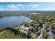 Breathtaking aerial view of a community with lake, pool, and tennis courts at 4214 Lake Underhill Rd # A, Orlando, FL 32803