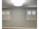 An updated bedroom with modern light fixture and window shutters at 4214 Lake Underhill Rd # A, Orlando, FL 32803