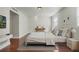 Bedroom showcasing a bed with plush pillows, warm lighting, and a view of the outdoor landscape at 4214 Lake Underhill Rd # A, Orlando, FL 32803