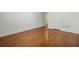 Clean and bright bedroom with hardwood floors and neutral walls at 4214 Lake Underhill Rd # A, Orlando, FL 32803