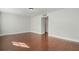 A bedroom with hardwood floors, neutral walls, and ample natural light for a serene atmosphere at 4214 Lake Underhill Rd # A, Orlando, FL 32803