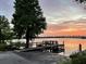 Beautiful lake view with a wooden dock perfect for enjoying the sunrise or sunset at 4214 Lake Underhill Rd # A, Orlando, FL 32803