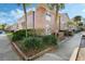 Exterior view highlighting attractive brickwork, mature landscaping, and manicured grounds at 4214 Lake Underhill Rd # A, Orlando, FL 32803