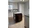 Kitchen with a wooden island, ample counter space, and tile flooring at 4214 Lake Underhill Rd # A, Orlando, FL 32803