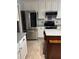 Kitchen features stainless steel appliances, granite countertops, and a center island at 4214 Lake Underhill Rd # A, Orlando, FL 32803
