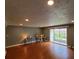 Spacious living room featuring hardwood floors, neutral paint and a sliding door to the outside at 4214 Lake Underhill Rd # A, Orlando, FL 32803