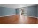 Bright living room with hardwood floors and sliding glass doors to a patio or balcony at 4214 Lake Underhill Rd # A, Orlando, FL 32803