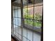 Enclosed patio with tiled floor overlooking lush landscaping at 4214 Lake Underhill Rd # A, Orlando, FL 32803