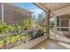 Screened patio with lovely garden view offering a private outdoor experience at 4214 Lake Underhill Rd # A, Orlando, FL 32803