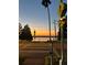 Street view of a crosswalk near the lake with a view of the sunset on the water at 4214 Lake Underhill Rd # A, Orlando, FL 32803