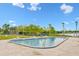 Community swimming pool with plenty of lounge chairs near the water at 4312 Lake Underhill Rd # 19, Orlando, FL 32803