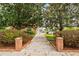 Landscaped walkway leading to community pool and amenities with lush trees and shrubs at 4312 Lake Underhill Rd # 19, Orlando, FL 32803