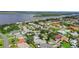 Aerial view of a quiet coastal neighborhood with a mix of waterfront and inland homes at 44 Capistrano Dr, Ormond Beach, FL 32176