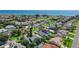 Aerial view of a quiet coastal neighborhood in Ormond Beach with lush landscaping and coastal views at 44 Capistrano Dr, Ormond Beach, FL 32176