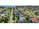 Aerial view of a quiet coastal neighborhood in Ormond Beach with lush landscaping and coastal views at 44 Capistrano Dr, Ormond Beach, FL 32176