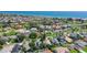 Aerial view of a quiet coastal neighborhood in Ormond Beach with lush landscaping near the ocean at 44 Capistrano Dr, Ormond Beach, FL 32176