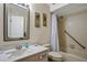 Clean, well-lit bathroom featuring a shower, sink, and toilet at 44 Capistrano Dr, Ormond Beach, FL 32176