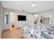 Bright bedroom featuring tile floors, neutral walls, and a bathroom view through the open door at 44 Capistrano Dr, Ormond Beach, FL 32176