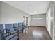 A waiting area with a row of chairs on tile flooring with paneled doors and a skylight overhead at 44 Capistrano Dr, Ormond Beach, FL 32176