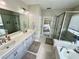 Luxurious bathroom features a double vanity, soaking tub and a glass shower enclosure at 453 Oviedo Blvd, Oviedo, FL 32765