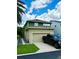 Exterior of two-story home with a driveway, garage, and neatly trimmed lawn at 453 Oviedo Blvd, Oviedo, FL 32765