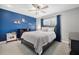 Bedroom with blue accent wall and contemporary decor at 460 Forestwood Ln, Maitland, FL 32751