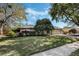 Charming single-story home boasting a well-manicured lawn and beautiful stone facade at 460 Forestwood Ln, Maitland, FL 32751