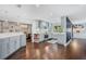 A spacious kitchen featuring modern grey cabinetry, white countertops and dark hardwood flooring at 460 Forestwood Ln, Maitland, FL 32751