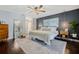 Serene main bedroom featuring a king-size bed, stylish decor, and a large mirror creating an open feel at 460 Forestwood Ln, Maitland, FL 32751