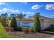 A welcoming community sign at Somerset at Sanford Farms with manicured landscaping and stone facade at 5142 Sage Cedar Pl, Sanford, FL 32771