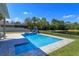 Relaxing pool and spa area with rock feature and fenced yard at 5142 Sage Cedar Pl, Sanford, FL 32771