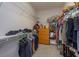 Well-organized walk-in closet with ample shelving, hanging space, and a built-in dresser at 5142 Sage Cedar Pl, Sanford, FL 32771