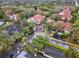 Aerial view of community entrance with mature trees and water features at 520 Via Verona Lane # 103, Altamonte Springs, FL 32714