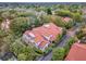 Aerial view of the homes with red roofs surrounded by lush greenery and trees at 520 Via Verona Lane # 103, Altamonte Springs, FL 32714