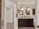 Elegant bathroom features a double sink vanity, granite countertops, and a walk-in closet at 520 Via Verona Lane # 103, Altamonte Springs, FL 32714