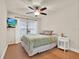 Relaxing bedroom featuring wood floors, neutral walls, and a ceiling fan at 520 Via Verona Lane # 103, Altamonte Springs, FL 32714