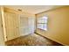 Bedroom with carpet, a closet, and a window at 5317 Hyde Park Ave, Orlando, FL 32808