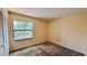 Cozy bedroom with a window and closet at 5317 Hyde Park Ave, Orlando, FL 32808