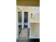 Hallway with linen closet and a partial view of a tub/shower combination in the bathroom at 5317 Hyde Park Ave, Orlando, FL 32808