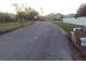 Residential street scene with paved road, tidy lawns, and houses in the background at 554 Lancer Oak Dr, Apopka, FL 32712