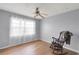 Empty bedroom featuring wood floors, a large window, and a ceiling fan at 611 Aldama Ct, Ocoee, FL 34761