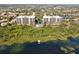 Beautiful lakeside condos with pool, walkway, dock, and scenic views at 6336 Buford St # 706, Orlando, FL 32835