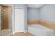 Bathroom with shower, soaking tub, and linen closet at 6336 Buford St # 706, Orlando, FL 32835